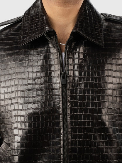 Close-up of a black textured jacket with a zipper