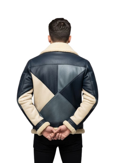 Man wearing a black and beige quilted leather jacket on a white background