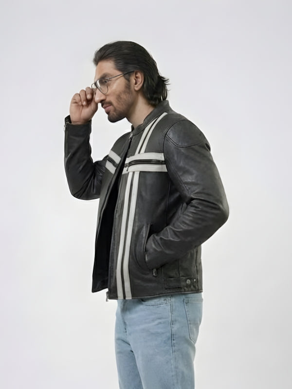 Man wearing a black leather jacket with white stripes on a white background