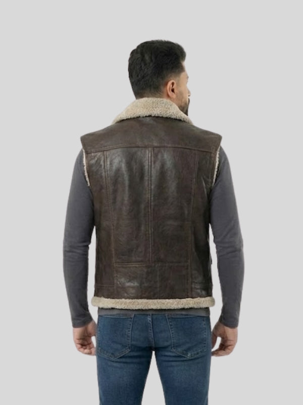 Man wearing a brown leather vest with sheepskin lining on a light gray background