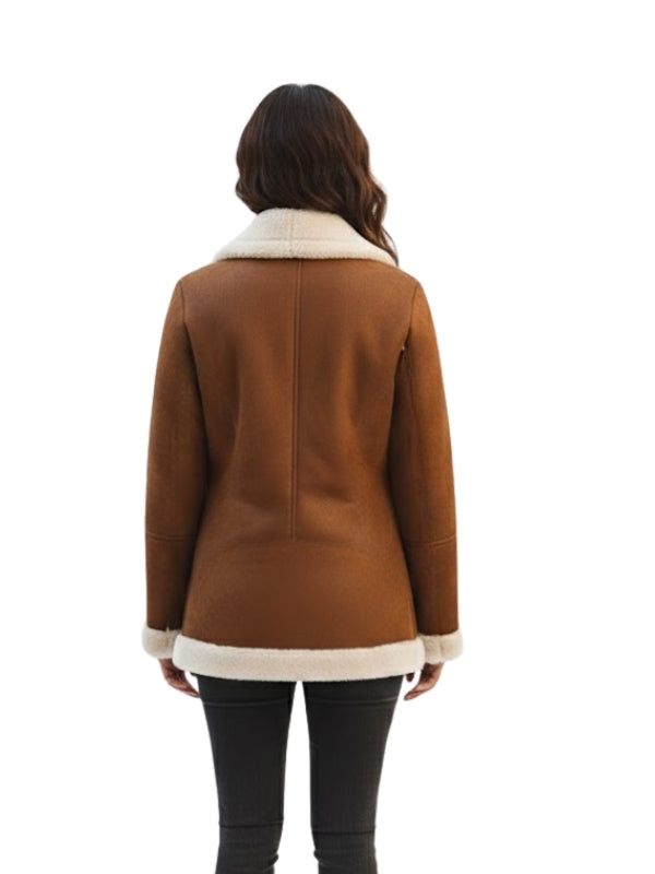 Brown coat with white trim worn by a person on a white background