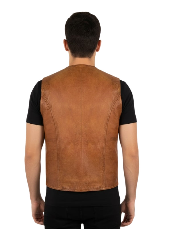 Man wearing a brown leather vest over a black shirt on a white background