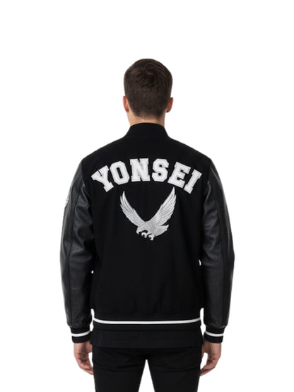 Person wearing a black varsity jacket with 'YONSEI' and an eagle logo on the back.