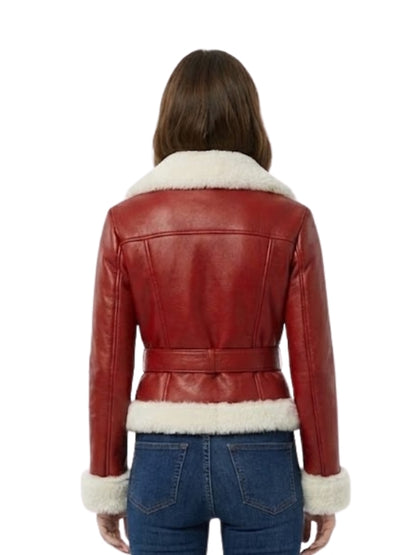 Red leather jacket with white fur trim worn by a person on a white background