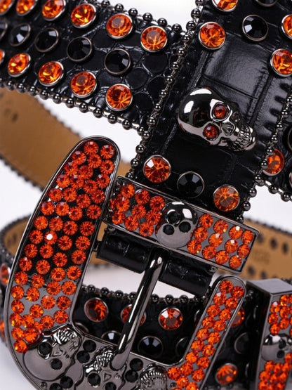 Black belt with orange rhinestone buckle on a white background