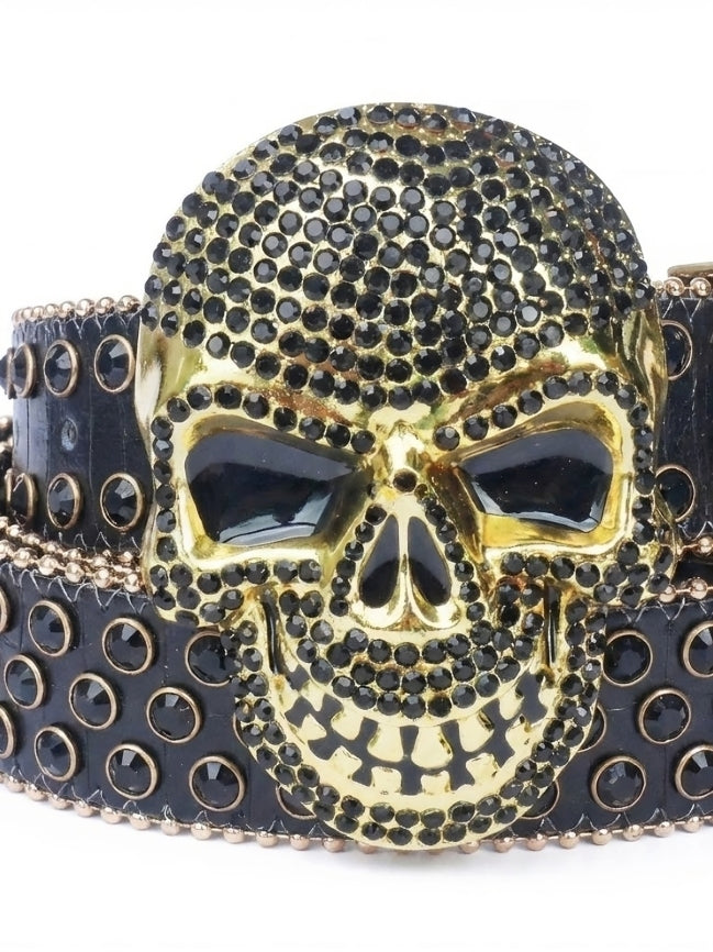 Gold and black skull belt buckle on a white background