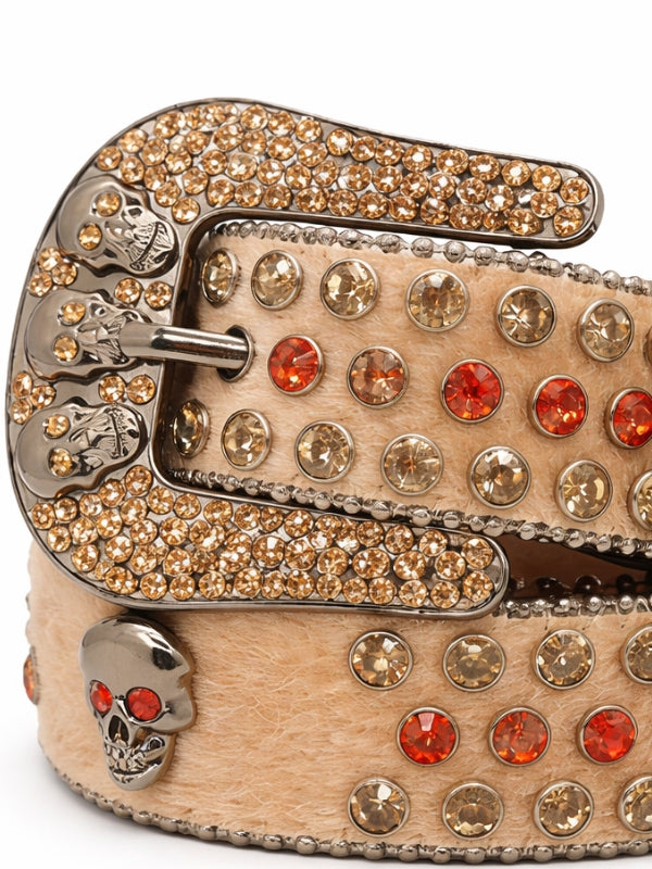 Decorative belt with rhinestones and skull designs on a white background