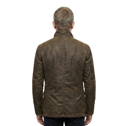 Brown leather jacket worn by a person on a white background
