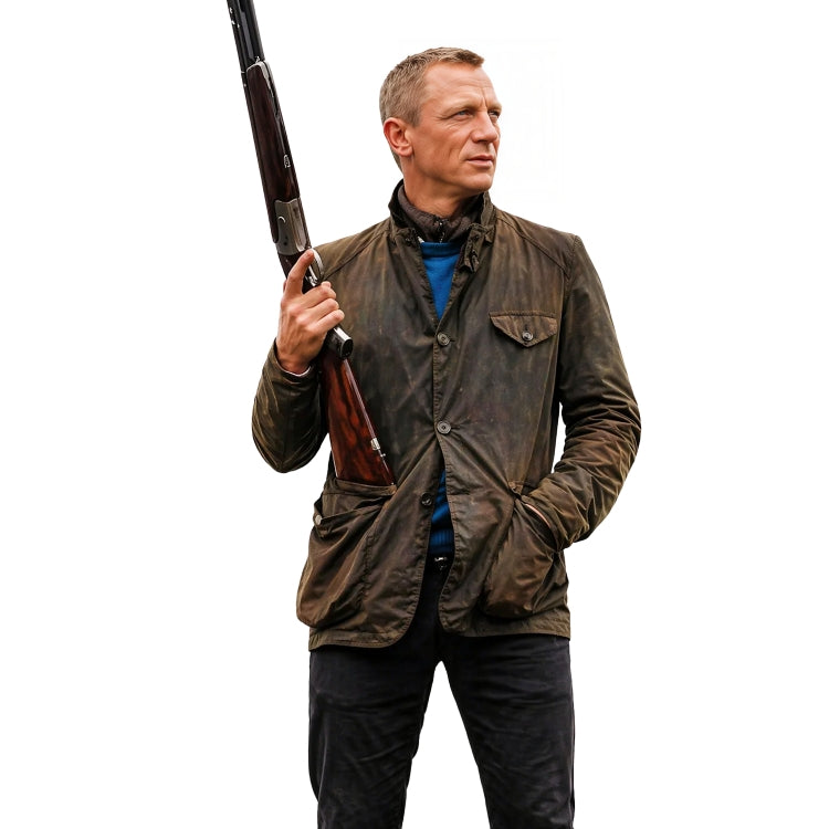 Man holding a shotgun wearing a brown jacket on a white background