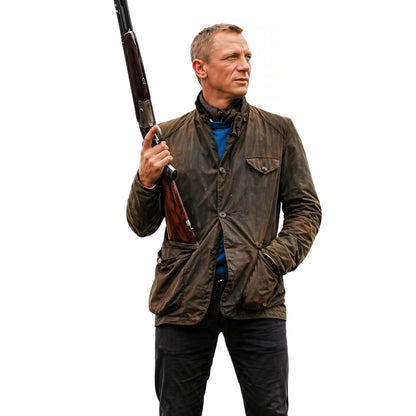 Man holding a shotgun wearing a brown jacket on a white background