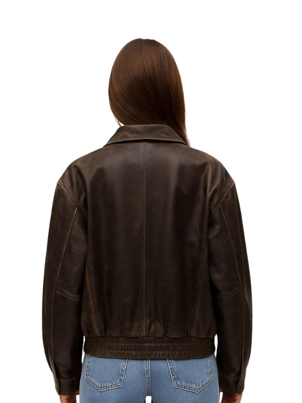 Person wearing a brown leather jacket on a white background