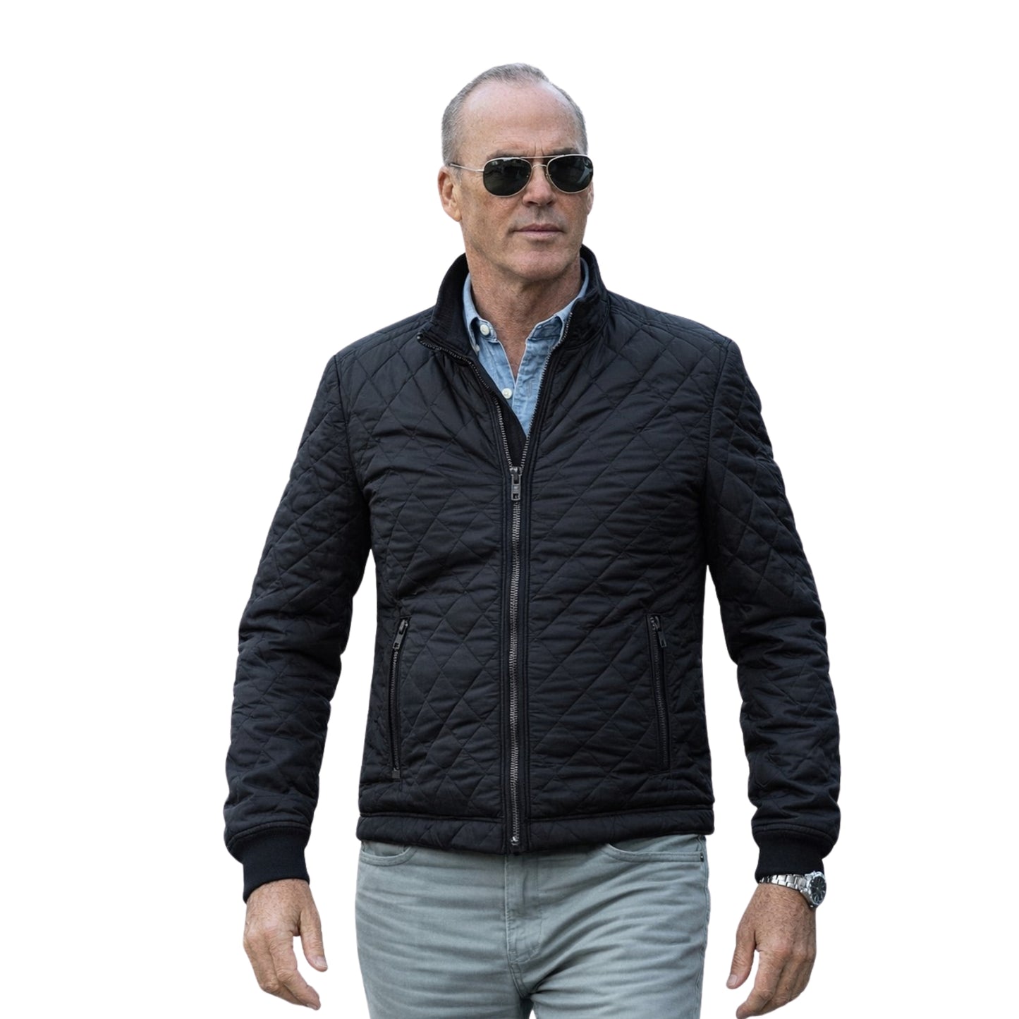 Man wearing a black quilted jacket and sunglasses on a white background