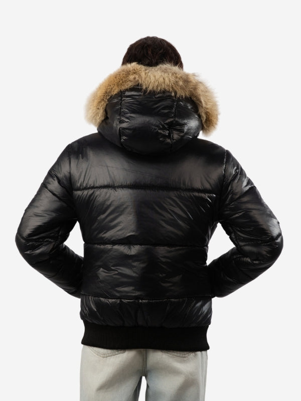 Black puffer jacket with fur hood on a white background
