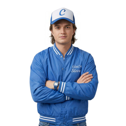 Person wearing a blue jacket with 'Coach Steve' text and a matching cap on a white background