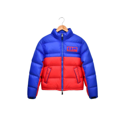 Blue and red puffer jacket on a hanger against a white background