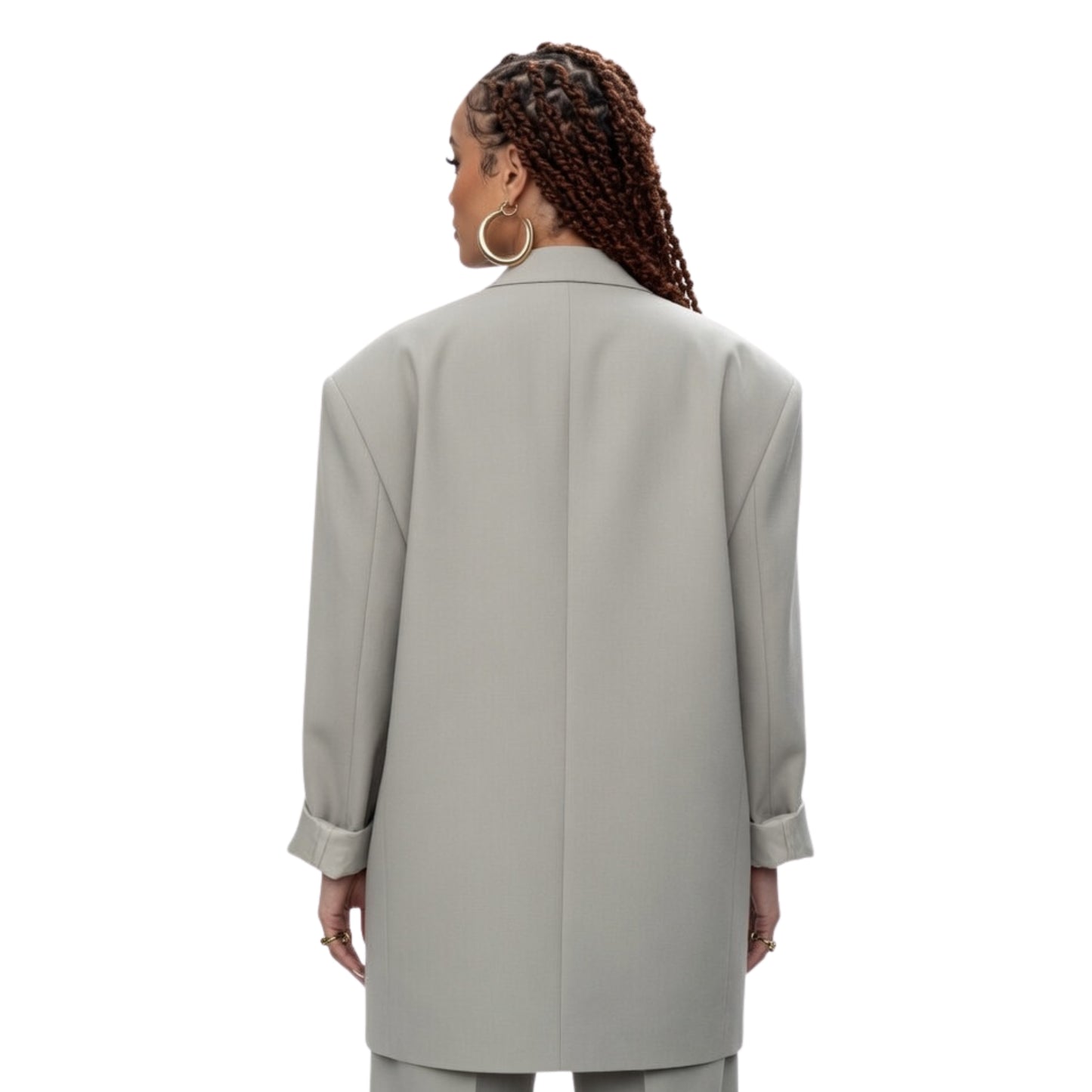 Person wearing a light gray coat on a white background