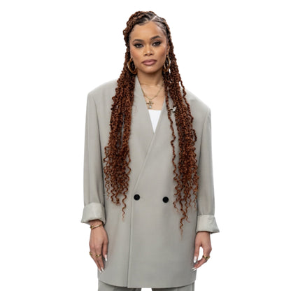 Woman wearing a light gray coat on a white background