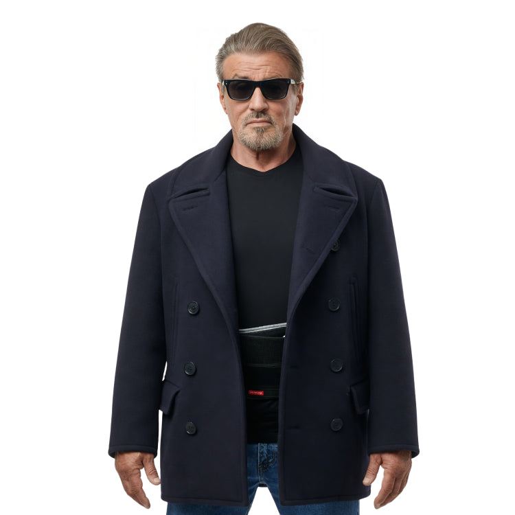 Man wearing a dark coat, black shirt, and sunglasses on a white background