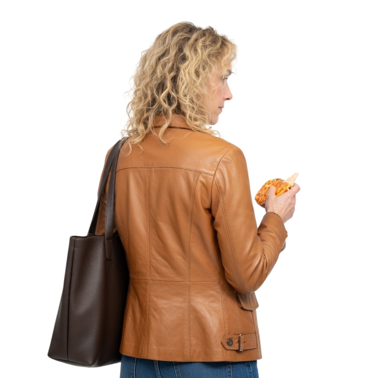 Woman in a brown leather jacket holding a bag and a pastry on a white background
