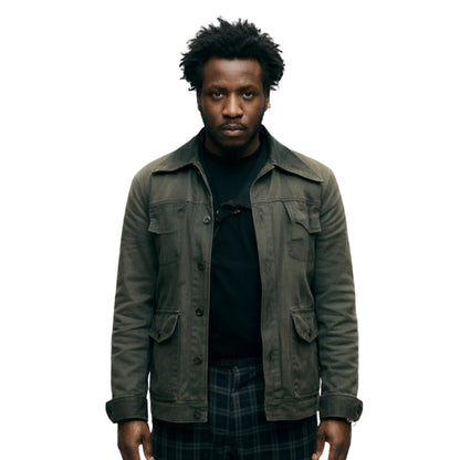 Man wearing a dark green jacket over a black shirt on a white background