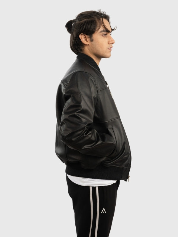 Person wearing a black leather jacket on a white background