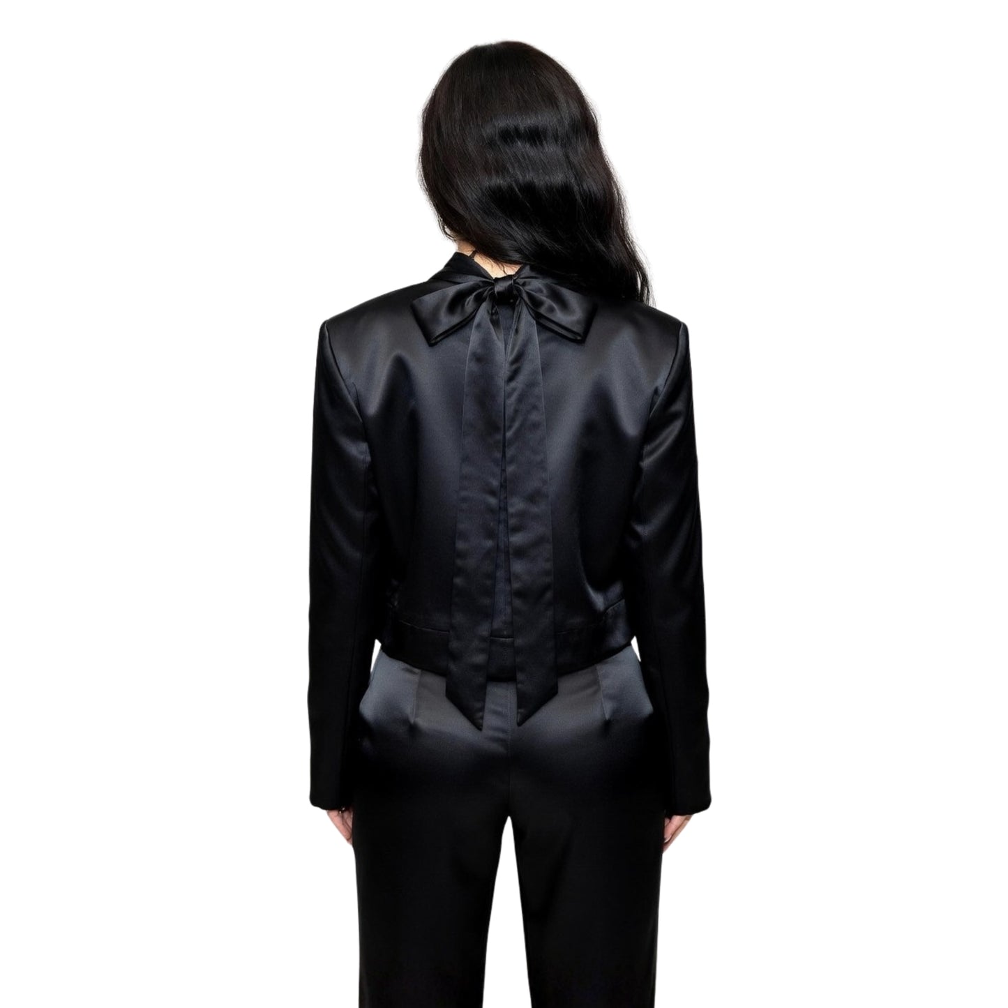 Person wearing a black satin outfit with a bow tie on a white background