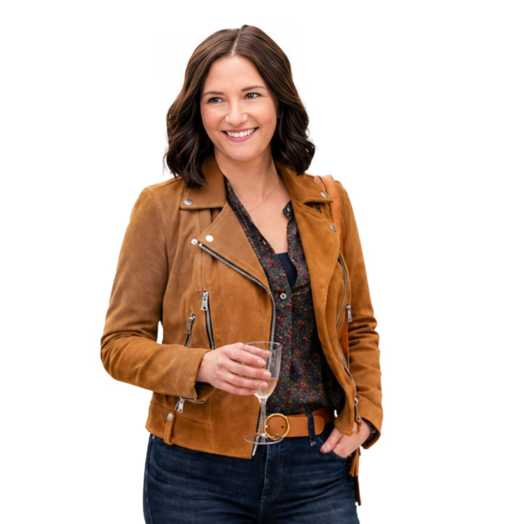 Woman wearing a brown leather jacket holding a glass of wine on a white background