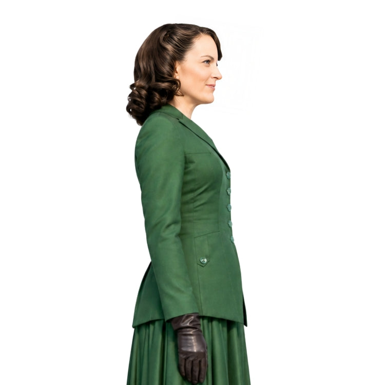Woman wearing a green suit with a white background