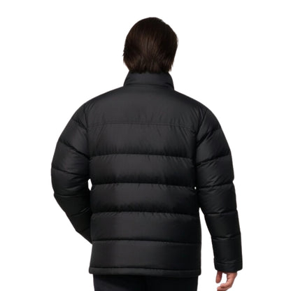 Person wearing a black puffer jacket on a white background