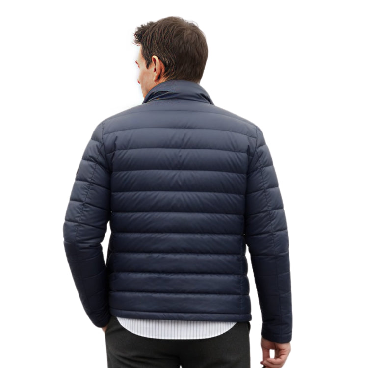 Man wearing a navy blue puffer jacket on a white background