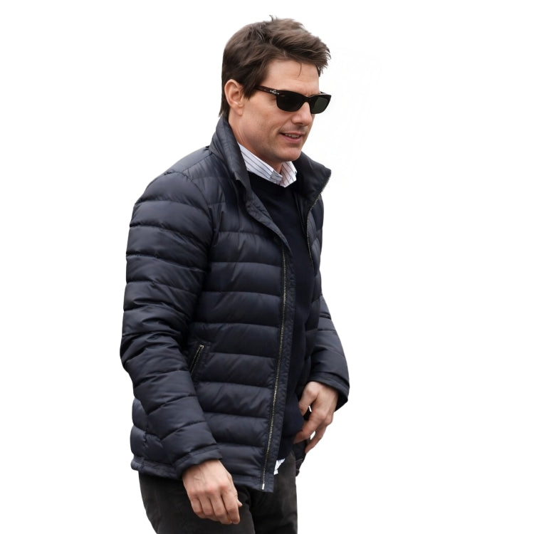 Man wearing a black puffer jacket and sunglasses on a white background