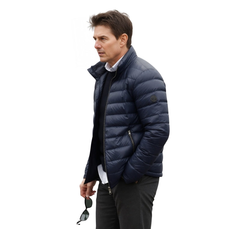 Man wearing a navy blue puffer jacket on a white background