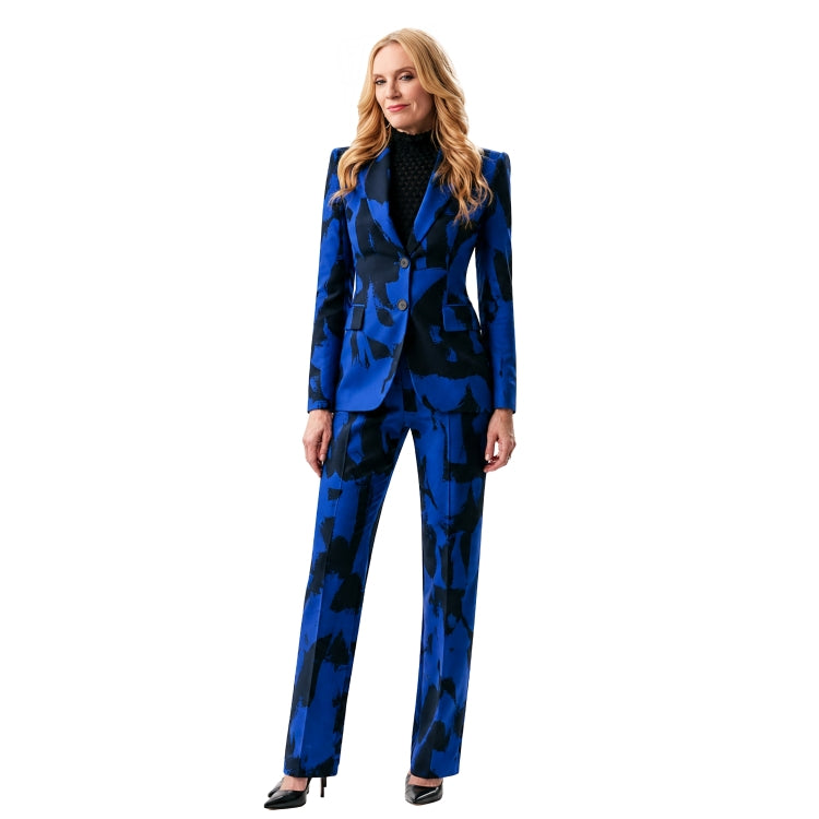 Woman wearing a blue patterned suit on a white background