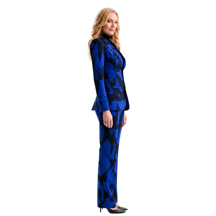 Woman wearing a blue and black patterned suit on a white background