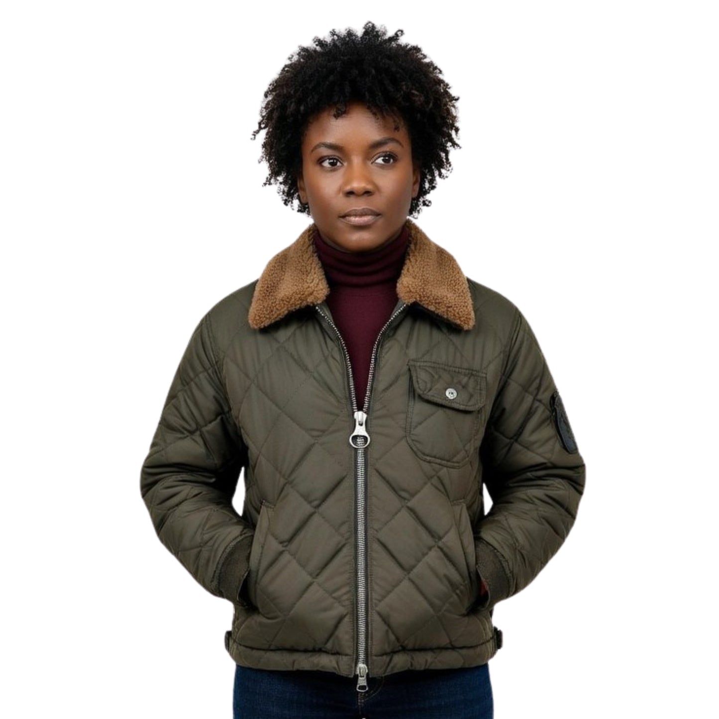 Person wearing a green quilted jacket with a brown fur collar on a white background