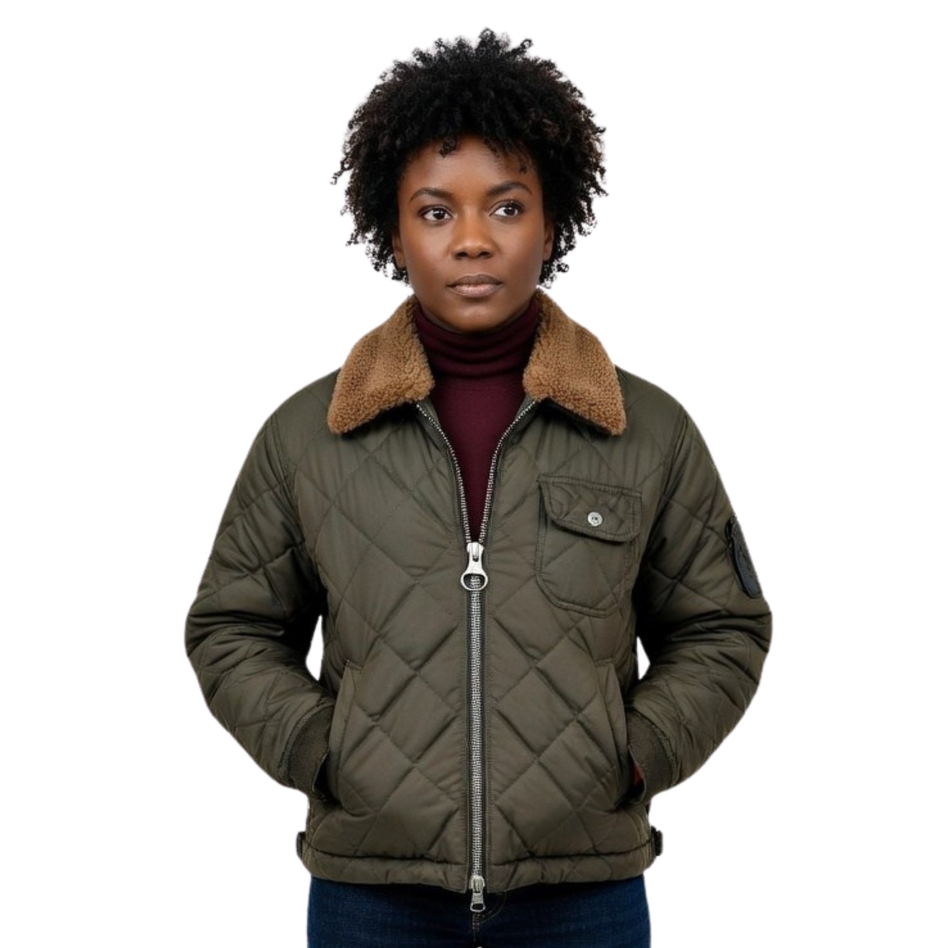 Person wearing a green quilted jacket with a brown fur collar on a white background
