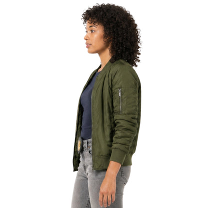 Woman wearing a green bomber jacket on a white background