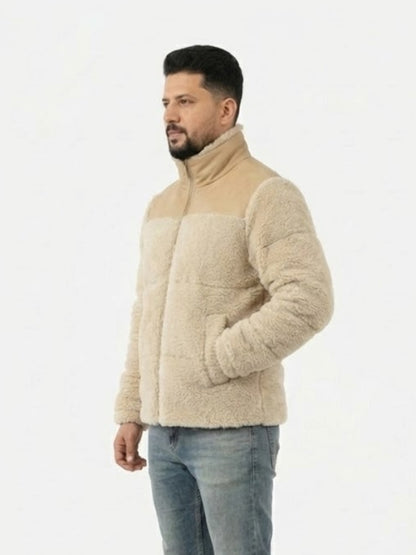 Man wearing a beige fleece jacket on a white background