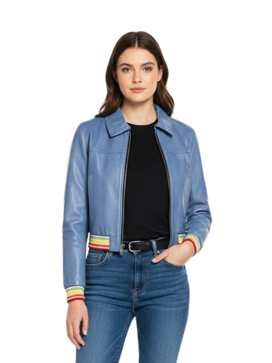 Woman wearing a blue jacket with colorful cuffs and jeans on a white background