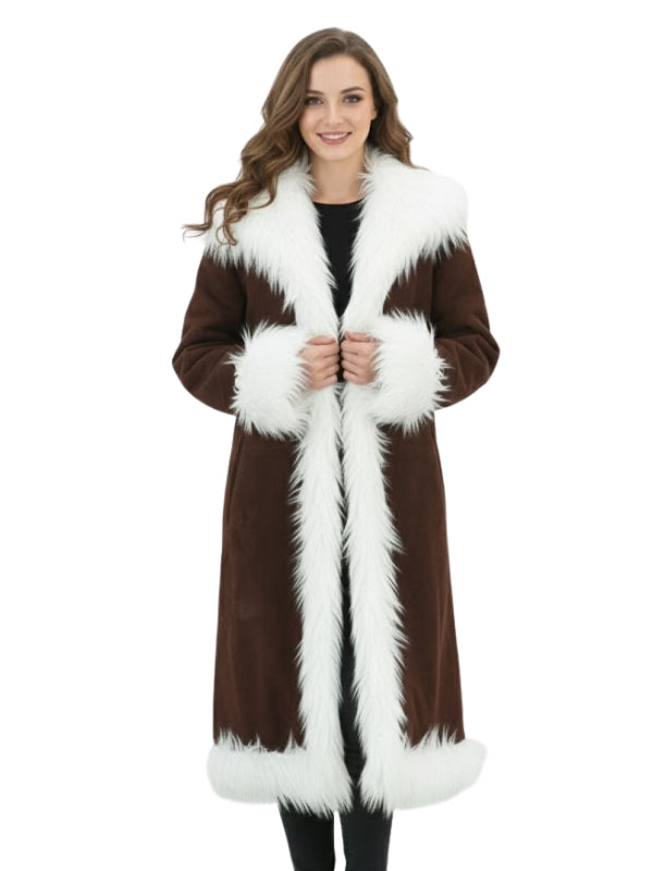 Woman wearing a brown coat with white fur trim on a white background
