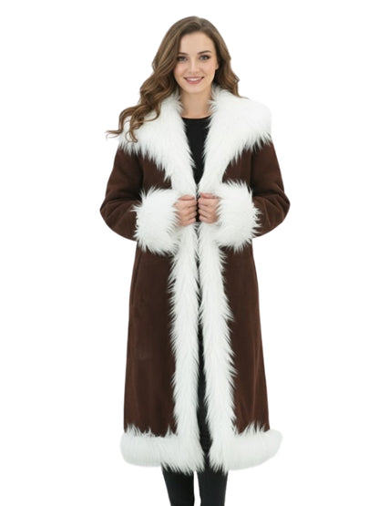 Woman wearing a brown coat with white fur trim on a white background