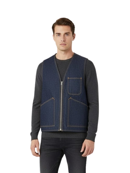 Man wearing a navy blue vest over a dark shirt on a white background