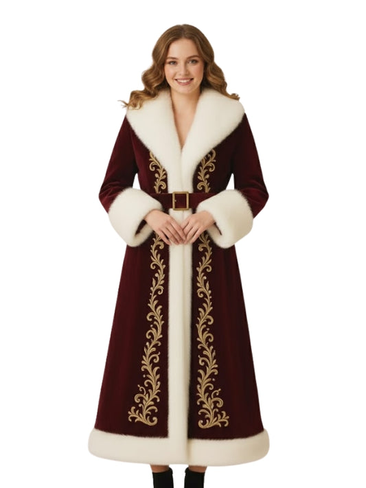 Woman wearing a long, ornate coat with white fur trim on a white background