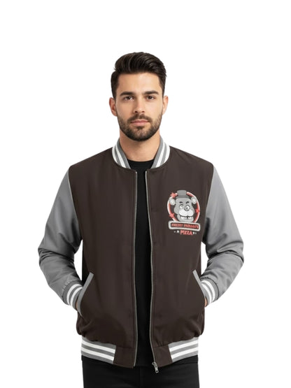 Man wearing a black and gray varsity jacket with a logo on a white background