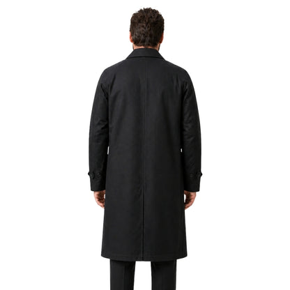 Man wearing a black coat from behind on a white background