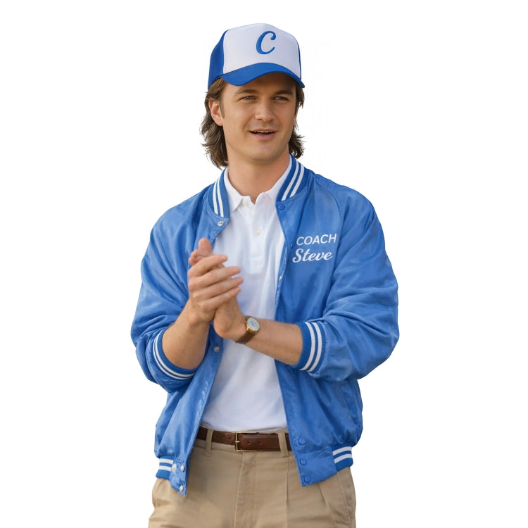 Man wearing a blue jacket with 'Coach Steve' text, white shirt, tan pants, and blue cap on a white background