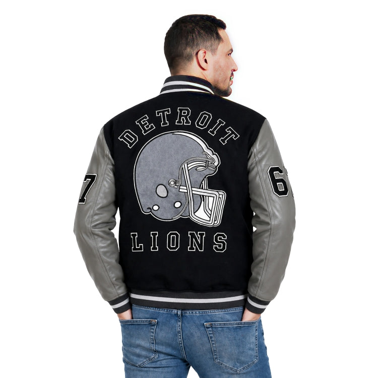 Man wearing a black and gray 'Detroit Lions' jacket with a helmet design on a white background