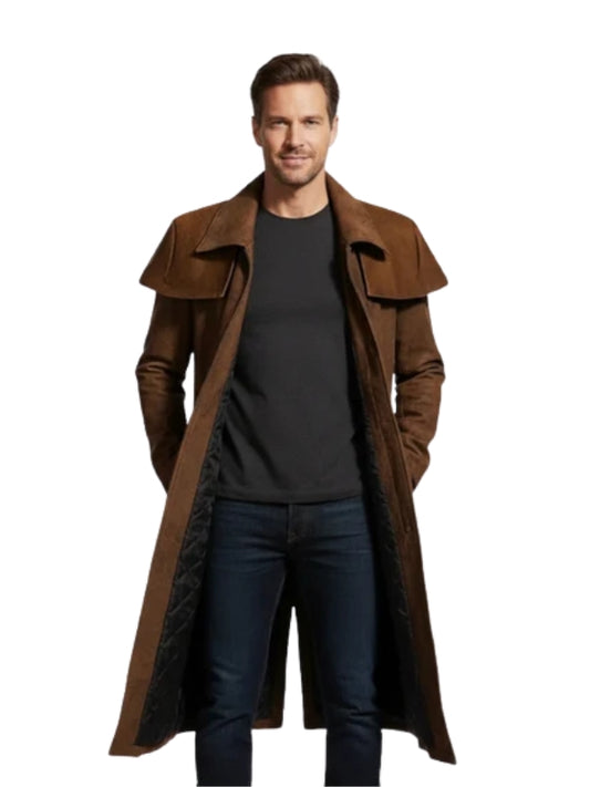 Man wearing a long brown coat over a black shirt on a white background