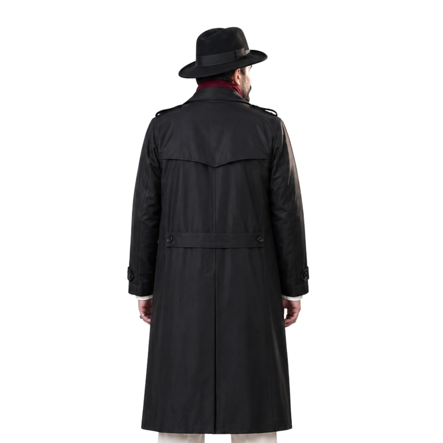 Man wearing a black trench coat and hat on a white background