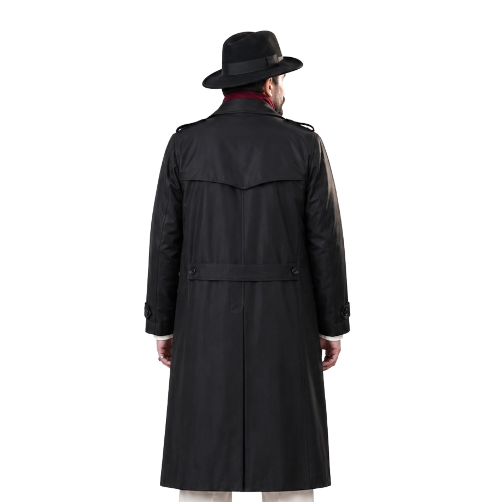 Man wearing a black trench coat and hat on a white background